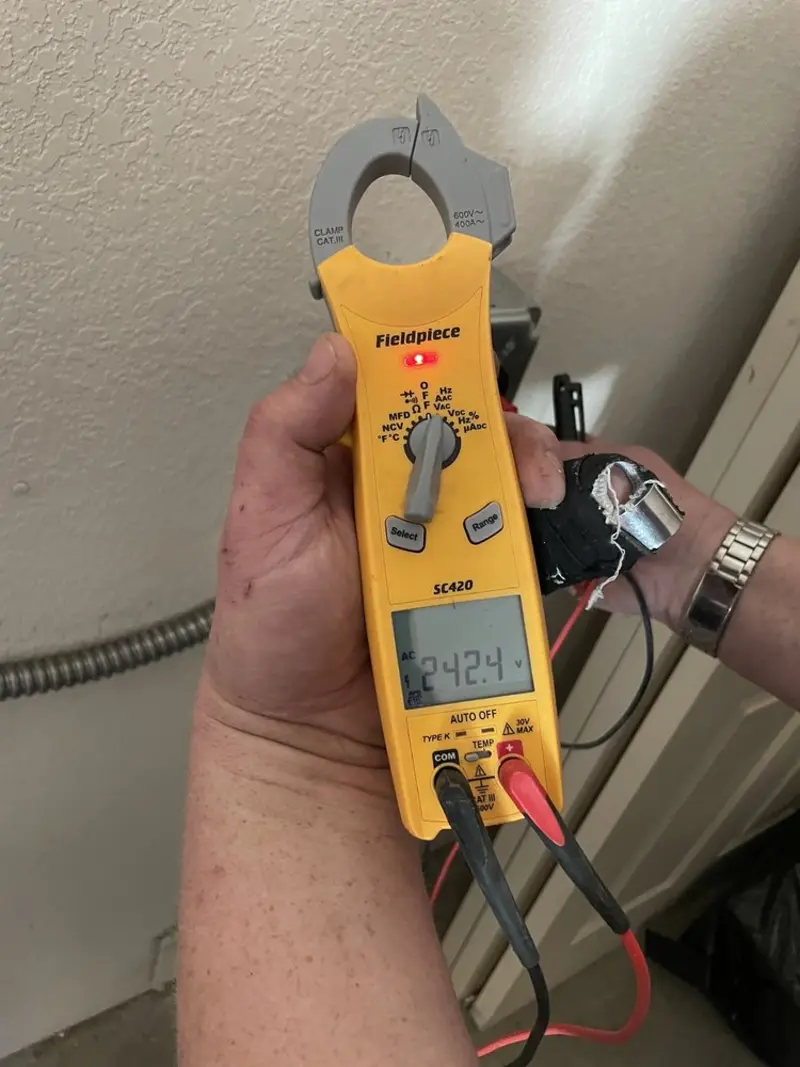 Voltage testing with clamp meter during Whole House Surge Protector in Hueytown
